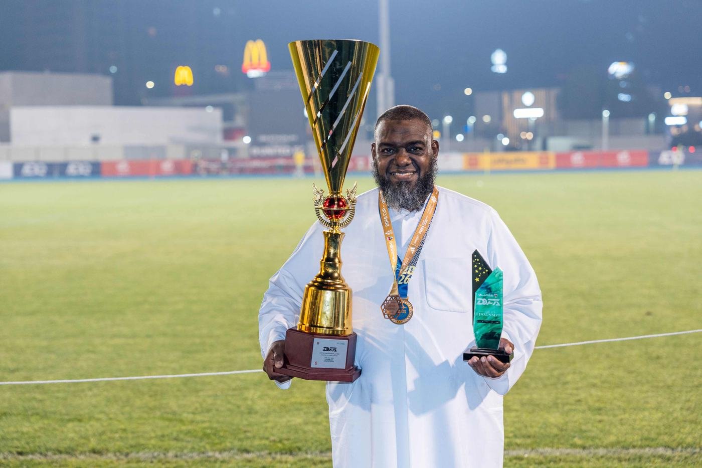 Club management holding a trophy